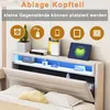 A bed with a headboard featuring storage and LED lighting. Anteprima dell’immagine prodotto