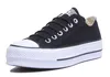 A black Converse Chuck Taylor All Star Lift Ox sneaker with a white platform sole, shown from a side angle against a white background. Voir les images du produit