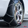 A close-up of a car tire with snow chains installed, showing the tread and the wheel rim. Produktbild-Vorschau