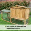 A wooden chicken coop with an attached run, set up on a grassy lawn with a hedge in the background. Produktbild-Vorschau