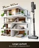 A cutaway view of a multi-story modern house, showcasing different rooms and furniture, with a cordless vacuum cleaner prominently displayed next to it. The text at the bottom highlights the vacuum's long runtime and coverage area. Produktbild-Vorschau