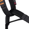 A close-up view of a black climbing harness with orange stitching. Náhľad obrázku produktu