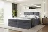 A bedroom scene with a large bed as the focal point.