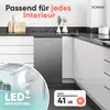 A small refrigerator is shown in a modern kitchen setting, with close-ups of its interior lighting and a graphic indicating its noise level. Produktbild-Vorschau