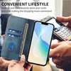 A person is holding a blue phone case with card slots and a phone, while another person is using a payment terminal. Anteprima dell’immagine prodotto
