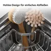 A close-up shot of two cleaning brushes with wooden handles placed in a metal sink drainer. Produktbild-Vorschau
