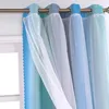 Close-up of layered curtains hanging from a rod. Voir les images du produit