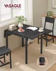 A small dining table set up in a room with a window and blinds. Produktbild-Vorschau