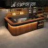 A modern bar counter with wooden panels and integrated lighting, set in a commercial space with shelves of products in the background. Voir les images du produit