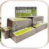 A stack of compressed coco peat bricks, wrapped in plastic, with product information labels. Produktbild-Vorschau
