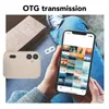 A person is holding a smartphone displaying a grid of photos, while a digital camera is placed next to them. The text 'OTG transmission' is displayed at the top. Produktbild-Vorschau