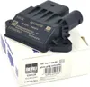 A black electronic control module for a car, placed on top of its white retail packaging. The packaging has text and a barcode visible. Podgląd zdjęcia produktu