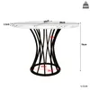 A round dining table with a marble-effect top and a black, sculptural base, shown with dimensions indicated. Náhled obrázku produktu
