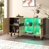A modern sideboard with open doors, illuminated by green LED lights, showcasing decorative items and books. Voir les images du produit