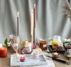 A collection of various candles and diffusers arranged on a table with a neutral background. Produktbild-Vorschau