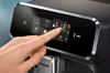 A close-up shot of a person's finger touching the screen of a coffee machine. Anteprima dell’immagine prodotto