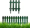 Two dark green plastic fence elements are shown against a white background, with a third element partially visible in the foreground, embedded in green grass. Produktbild-Vorschau