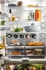 A well-stocked refrigerator with various food items and drinks. Produktbild-Vorschau