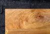 A close-up view of a wooden shelf against a textured black background. Produktbild-Vorschau