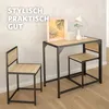 A desk and chair set in a minimalist setting with decorative items on the desk. Náhled obrázku produktu
