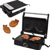 A taiyaki maker with two finished taiyaki pastries. Produktbild-Vorschau