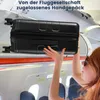 A person is placing a black suitcase into the overhead compartment of an airplane. Anteprima dell’immagine prodotto