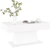 A white coffee table with a vase of green leaves, a magazine, and a cup of coffee on it. Voir les images du produit