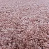 A close-up, textured view of a pink shaggy carpet. Anteprima dell’immagine prodotto