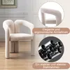 A beige velvet armchair is shown in a room with a framed picture on the wall. Inset images highlight the armrests and the metal frame. Voir les images du produit