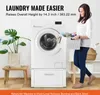 A woman is holding a laundry basket next to a raised washing machine. Voir les images du produit