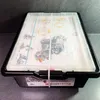 A black plastic storage bin with a clear lid containing a LEGO MINDSTORMS EV3 set. Produktbild-Vorschau