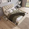 A bedroom scene with a tufted bed frame, bedding, and storage drawers. Anteprima dell’immagine prodotto