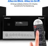 A close-up of a Medion micro audio system with a remote control being held by a hand. Produktbild-Vorschau