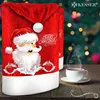 A festive Christmas scene with a Santa Claus themed chair cover and a cup of coffee. Produktbild-Vorschau