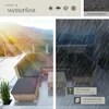 A split image showing a rattan lounge set on a sunny patio on the left, and the same lounge set in heavy rain on the right, highlighting its weather resistance. Náhled obrázku produktu
