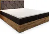 A bed with a tufted headboard and a mattress topper. Produktbild-Vorschau
