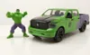A toy Hulk figure stands next to a toy pickup truck. Produktbild-Vorschau
