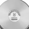 Close-up of the bottom of a pot with branding and symbols. Náhled obrázku produktu