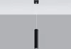 A black cylindrical pendant light hanging from a white ceiling. Produktbild-Vorschau