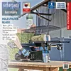A person is operating a wood splitter on a wooden table outdoors, with a building in the background. Produktbild-Vorschau