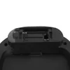 A close-up view of the battery compartment of a black automatic trash can. Voir les images du produit