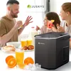 A family enjoying breakfast with an ice maker prominently displayed. Produktbild-Vorschau