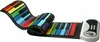 A flexible, rainbow-colored piano keyboard is laid out on a white background. Produktbild-Vorschau
