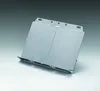 A silver-colored document holder is displayed on a light gray and white surface. Náhled obrázku produktu