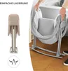 A split image showing a folded baby crib on the left and a person assembling or disassembling a baby crib on the right. Produktbild-Vorschau