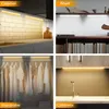 A collage of four images showing LED strip lights installed in different locations: under cabinets in a kitchen, on shelves, in a wardrobe, and under cabinets above a sink. Produktbild-Vorschau