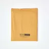 A folded yellow bedsheet on a white background. Produktbild-Vorschau