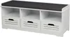 A white shoe bench with a dark gray cushion on top, featuring three open shelves and three drawers with slatted fronts. Produktbild-Vorschau