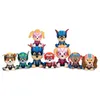 A group of Paw Patrol plush toys dressed as superheroes, arranged in two rows. Anteprima dell’immagine prodotto