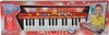 The image shows the retail packaging of a toy keyboard, with a picture of a child playing a similar keyboard on the box. Anteprima dell’immagine prodotto